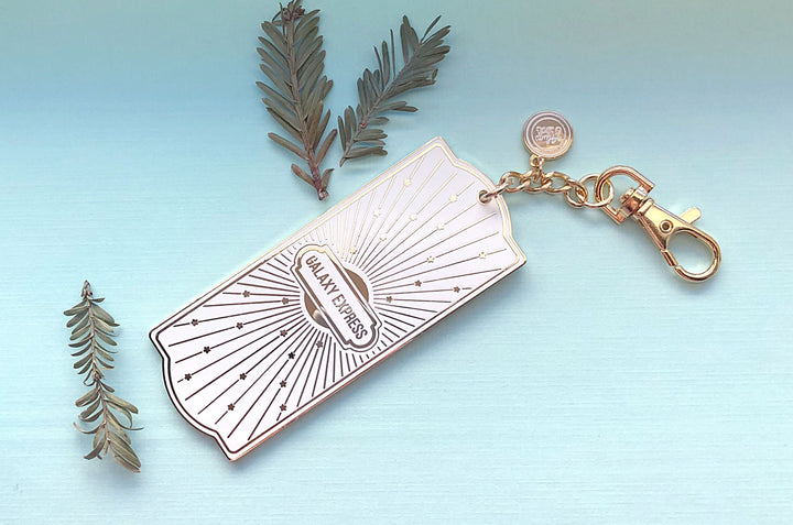 White and Gold Galaxy Express Train Ticket Charm
