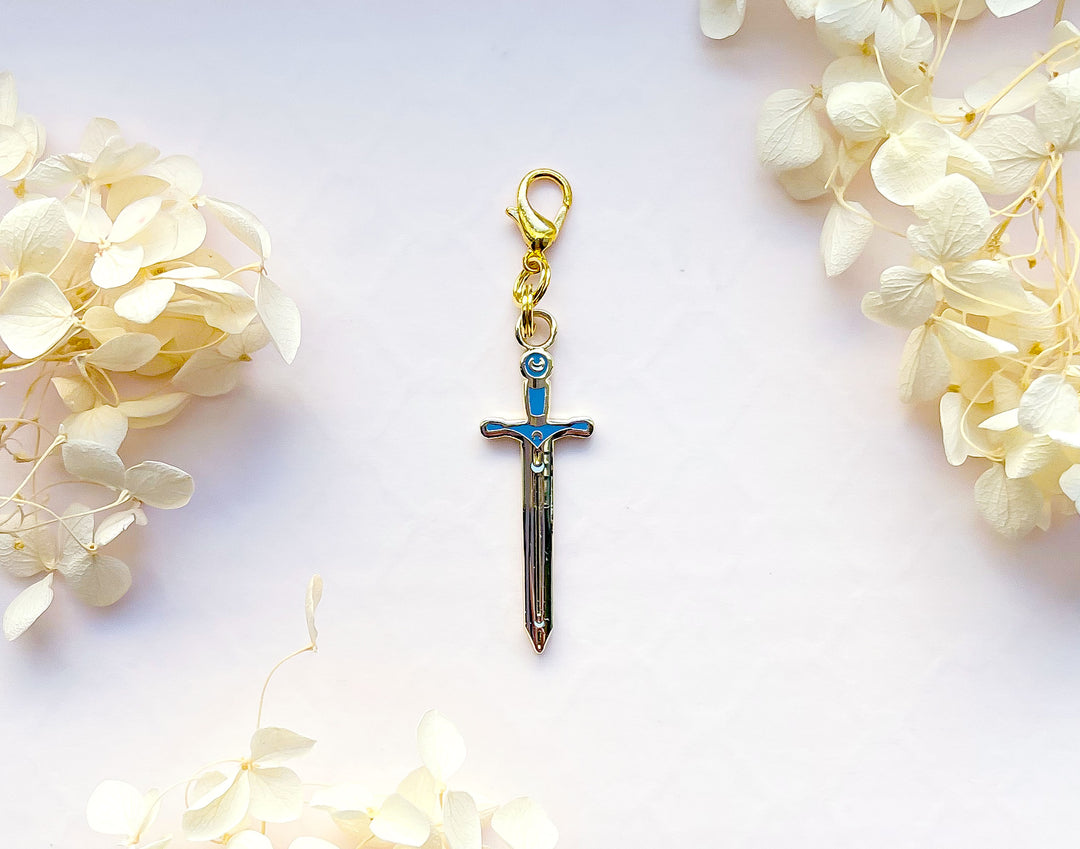Lunar Sword Enamel and Metal Glasses Charm