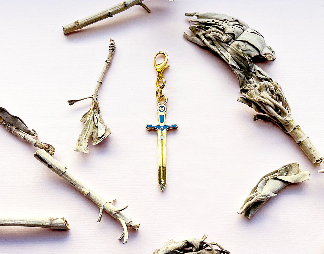 Lunar Sword Enamel and Metal Glasses Charm