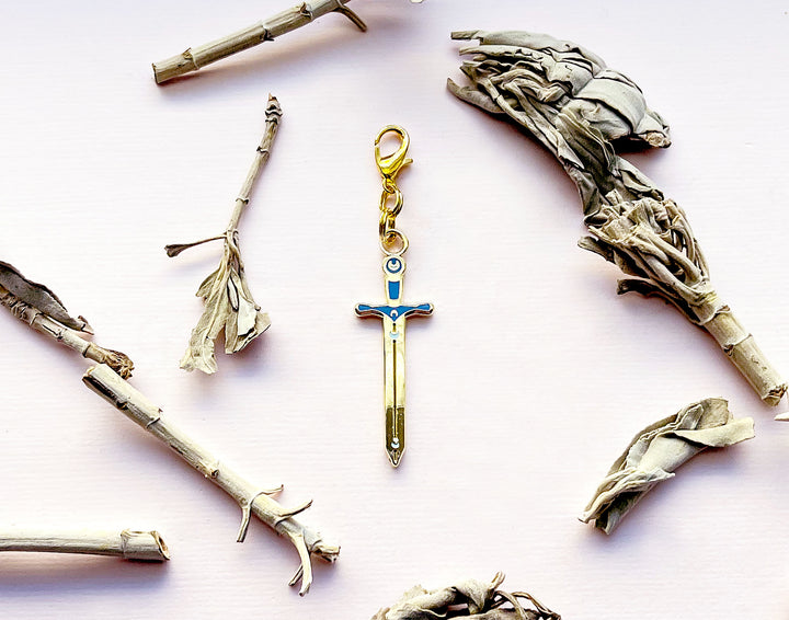 Lunar Sword Enamel and Metal Glasses Charm