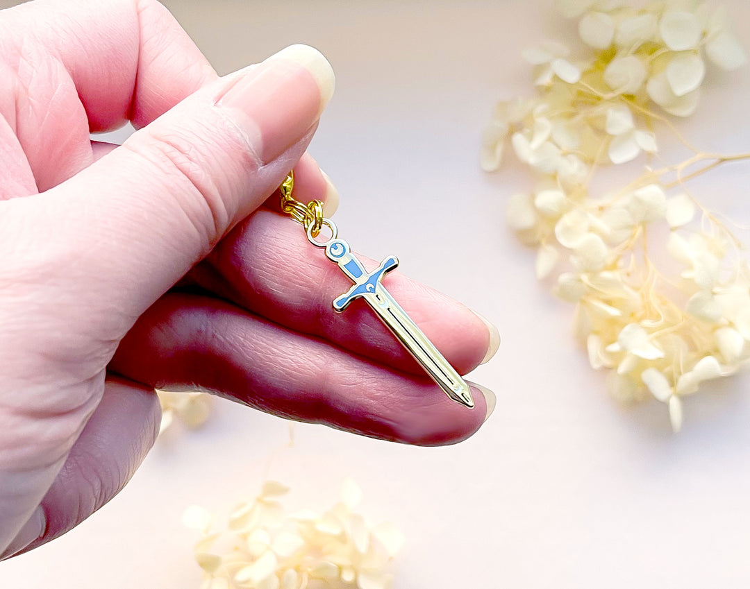 Lunar Sword Enamel and Metal Glasses Charm