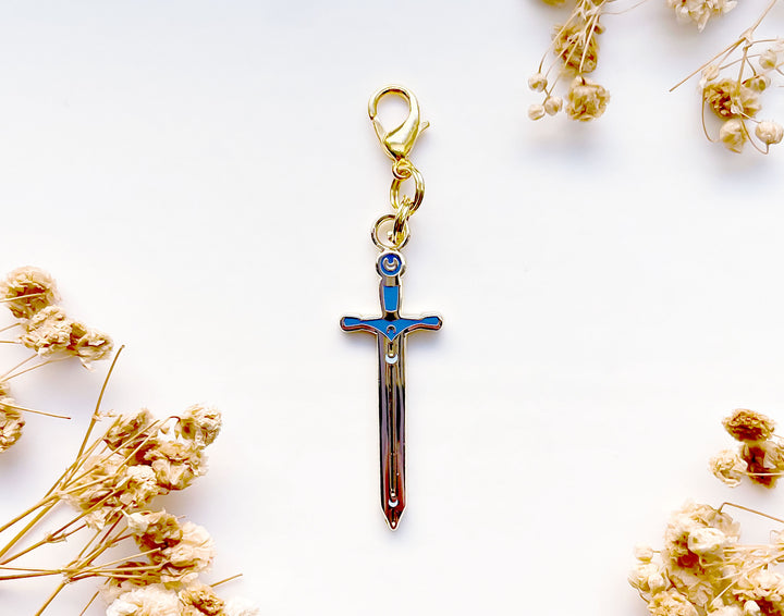 Lunar Sword Enamel and Metal Glasses Charm