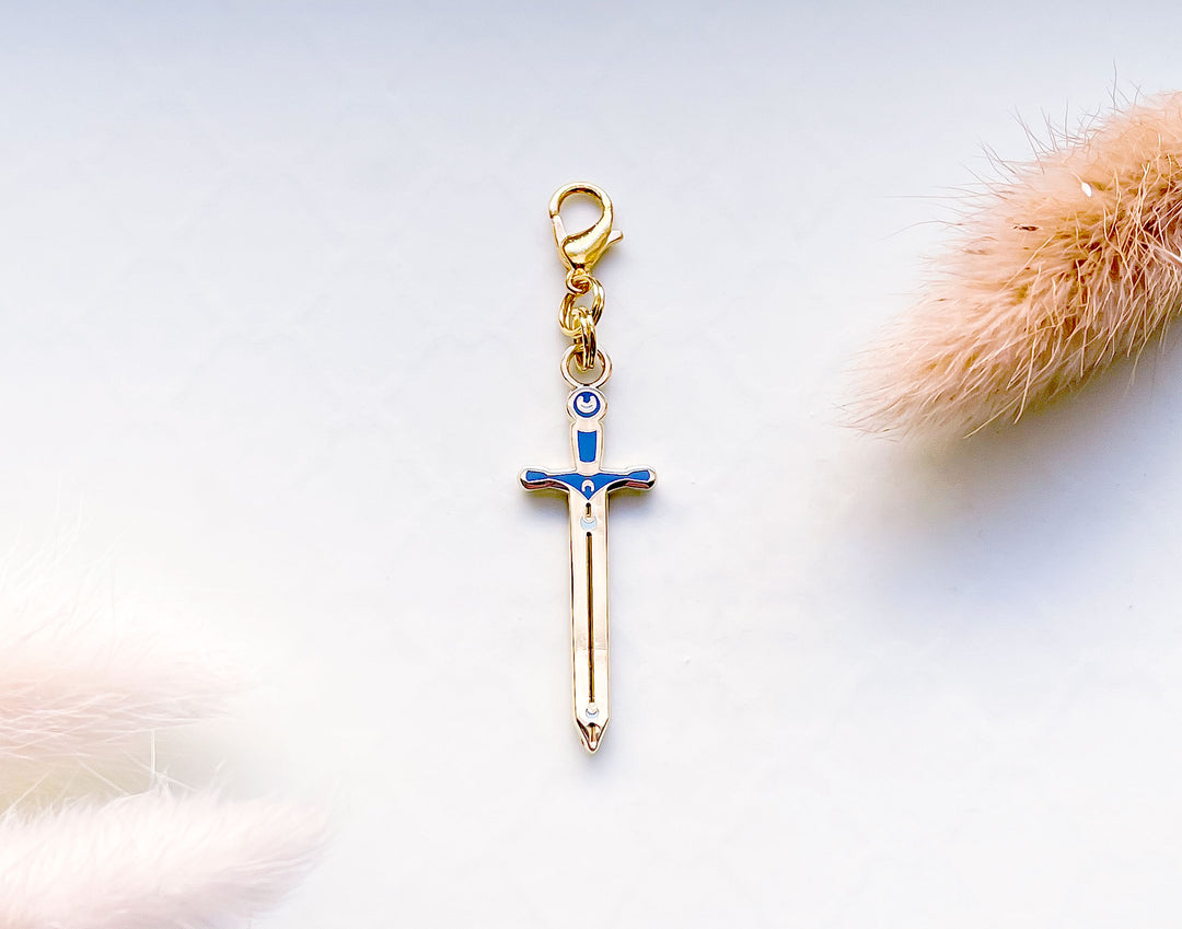 Lunar Sword Enamel and Metal Glasses Charm